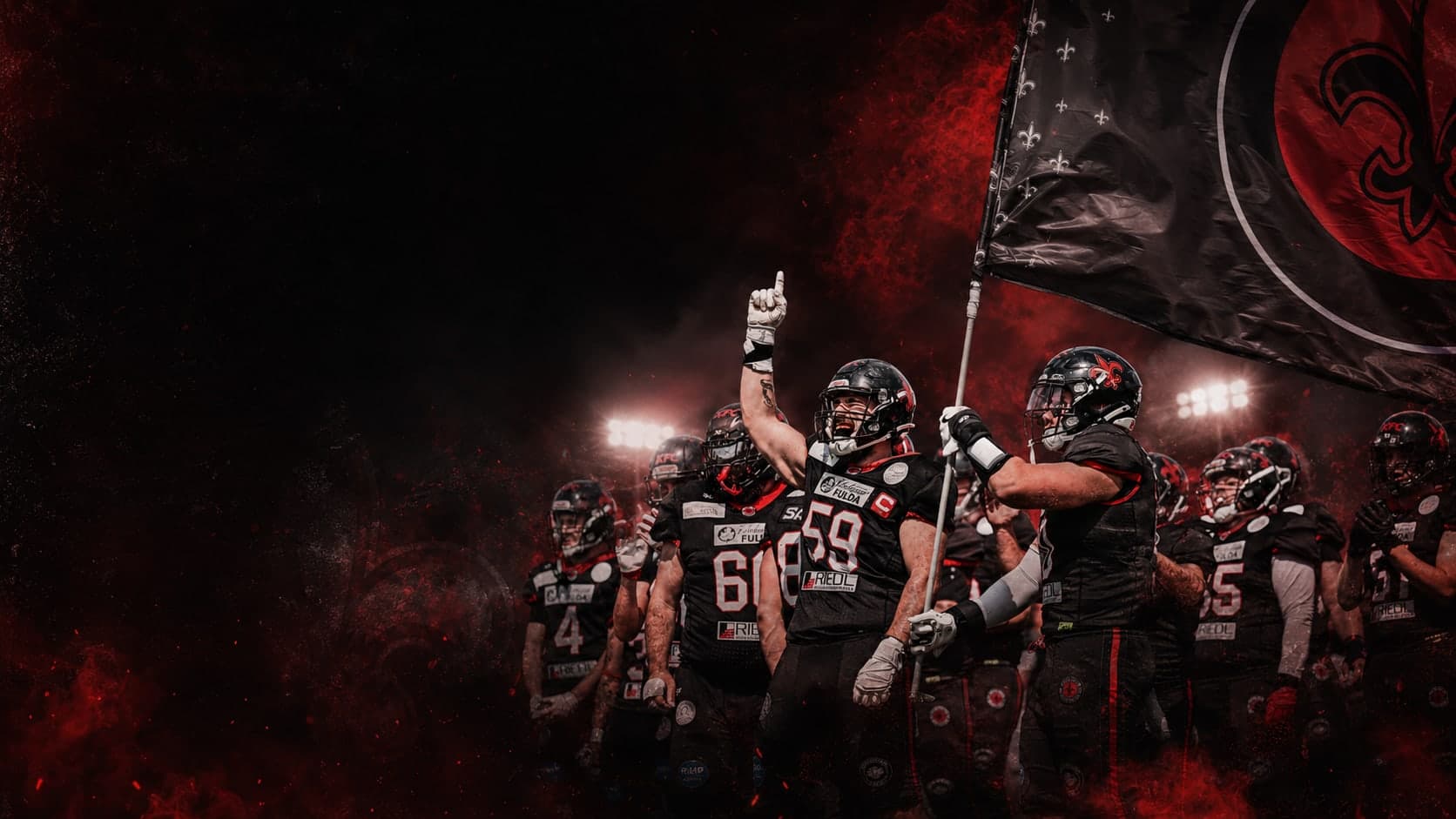 Fulda Saints taking the field with the team flag and crest
